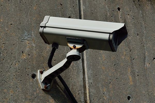A Security camera on a concrete wall for enhanced surveillance in Lubbock, TX
