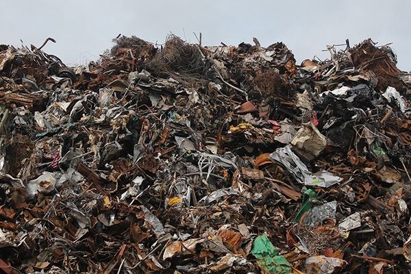 A collection of scrap metal positioned in front of a vast sky in Lubbock, TX 