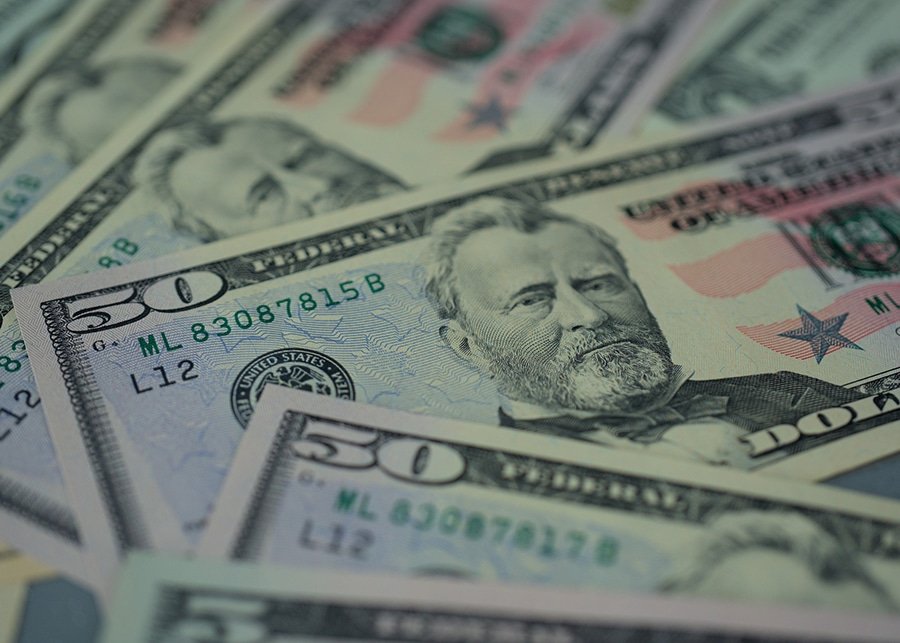 A Close-up View of a Pile of Cash featuring Various Denominations, taken in Lubbock, TX