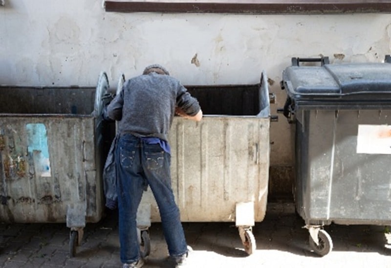 Dumpster diving man