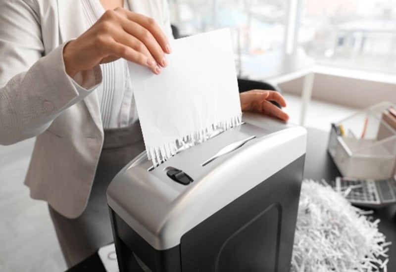 Woman shredding documents