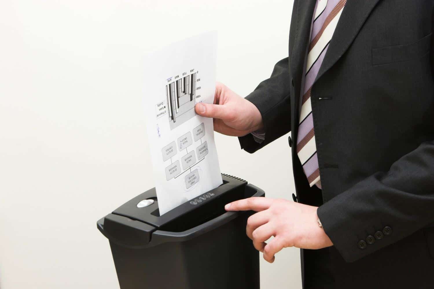Shredder Rental in Lubbock, TX, showing an office shredder in use for secure document disposal